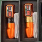 Tattoo pen machine showing battery display and stroke adjustment