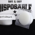 Tattoo needle cleaning cup showing sponge core and plastic cup